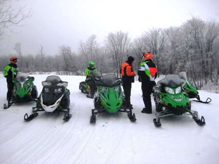 Arctic Cat Engineers stop to compare notes on the test sleds