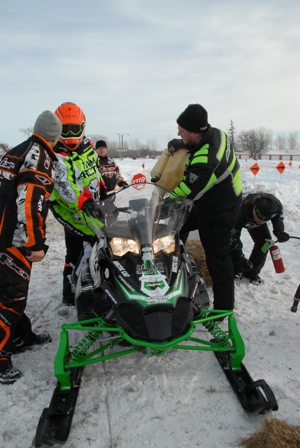Arctic Cat Product Manager, Joey Hallstrom getting fuel