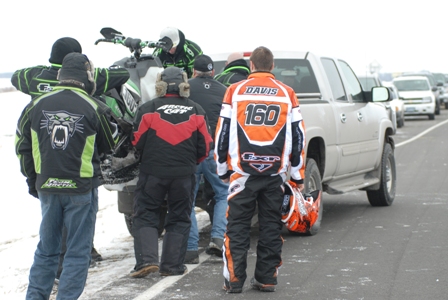 Cory Davis watches his sled get loaded