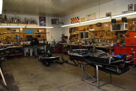 Two of the three Arctic Cat el tigre Cross-Country sleds in Nelson's shop