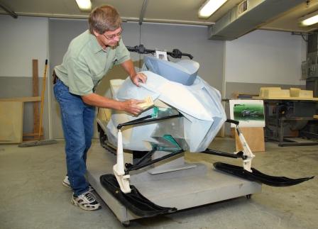 Nelson, fabbing a foam model of what would become a 2012 Arctic Cat