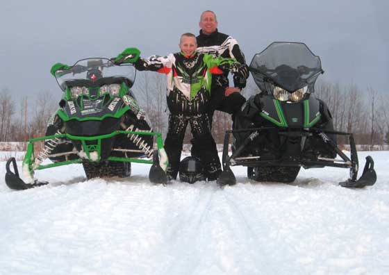 Me and my sone Calvin on a snowmobile ride last winter