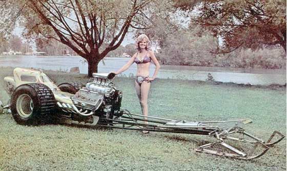 Summer snowmobile fun with bikinis and dragsters