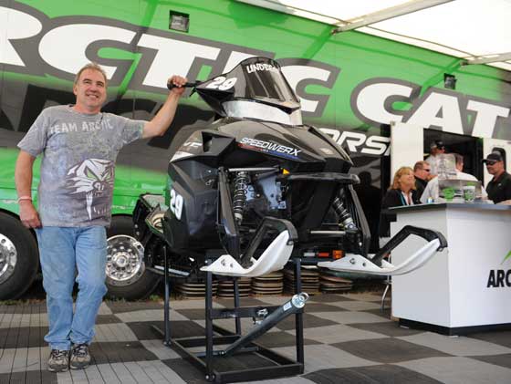 Team Arctic Cat racer Dale Lindbeck displays his sled in the Cat booth at Haydays