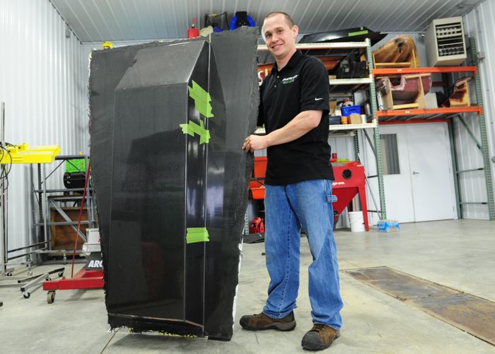 P.J. Wanderscheid and one of the carbon fiber tunnels for his race sled. 