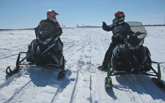 Arctic Cat's Brian Dick (R) and Roger Skime testing 2014 snowmobiles. Photo by ArcticInsider.com