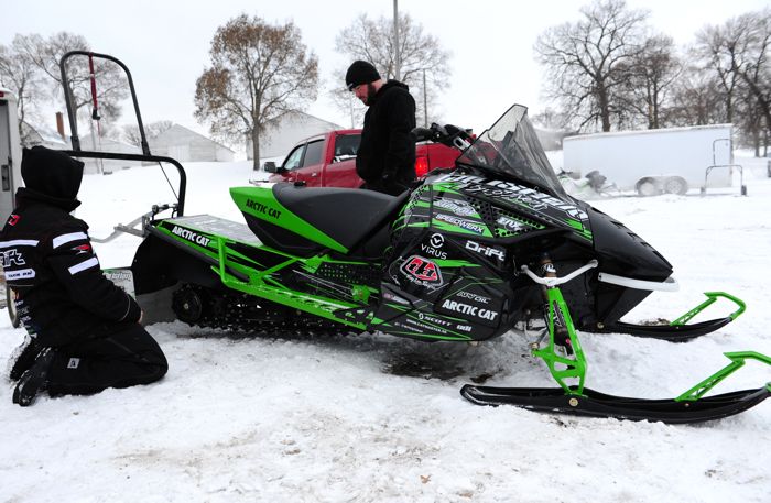 Ryan Simons (left) and Jeremy Houle prepare the Soo sled for racing at Willmar.