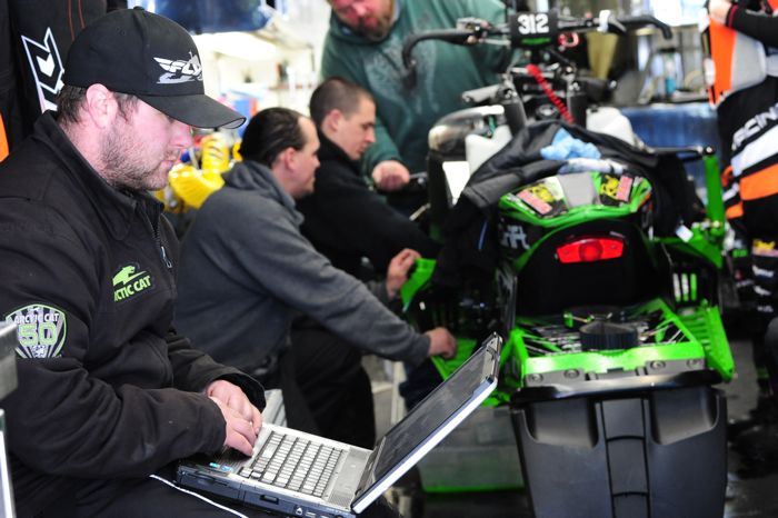 Arctic Cat engineer Blake Shoh looks at the download of engine info from the test