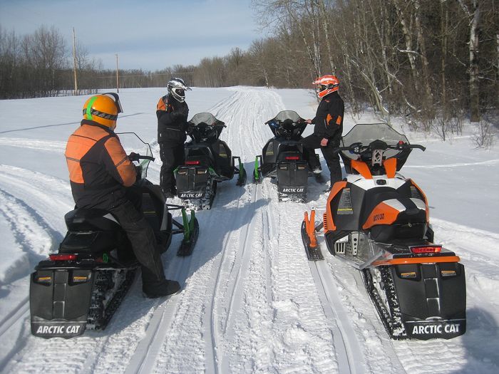 Arctic Cat engineers test-riding snowmobiles. Photo by ArcticInsider.com