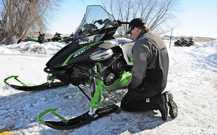 Arctic Cat snowmobile engineer Bart Magner calibrating a ZR4000RR. Photo by ArcticInsider.com