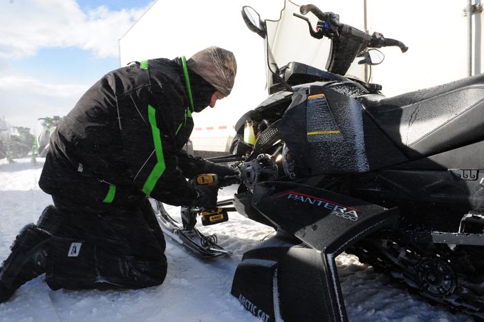 Arctic Cat snowmobile engineer Bart Magner calibrating a 2016 Pantera. Photo by ArcticInsider.com