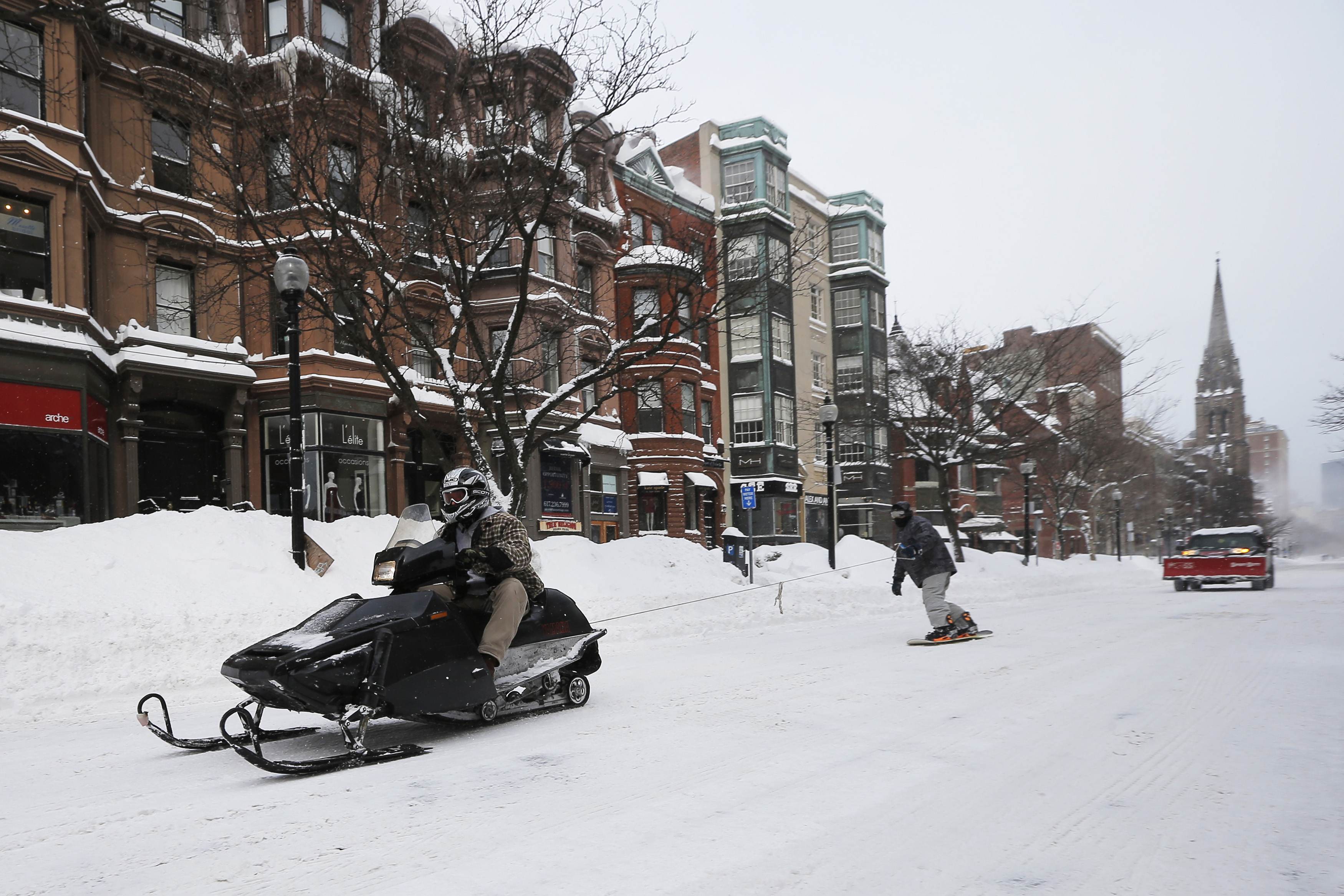 TGIF: The snowboard and snowmobile in the street edition. 