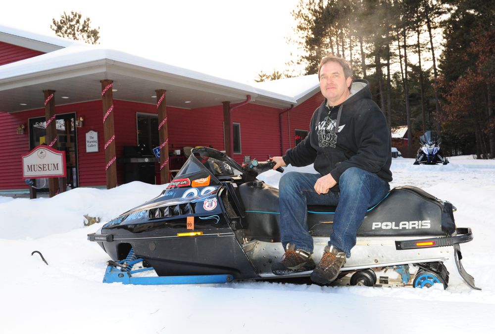 Jeremy Fyle with his '89 Polaris Indy at the snowmobile hall of fame. Photo ArcticInsider.com