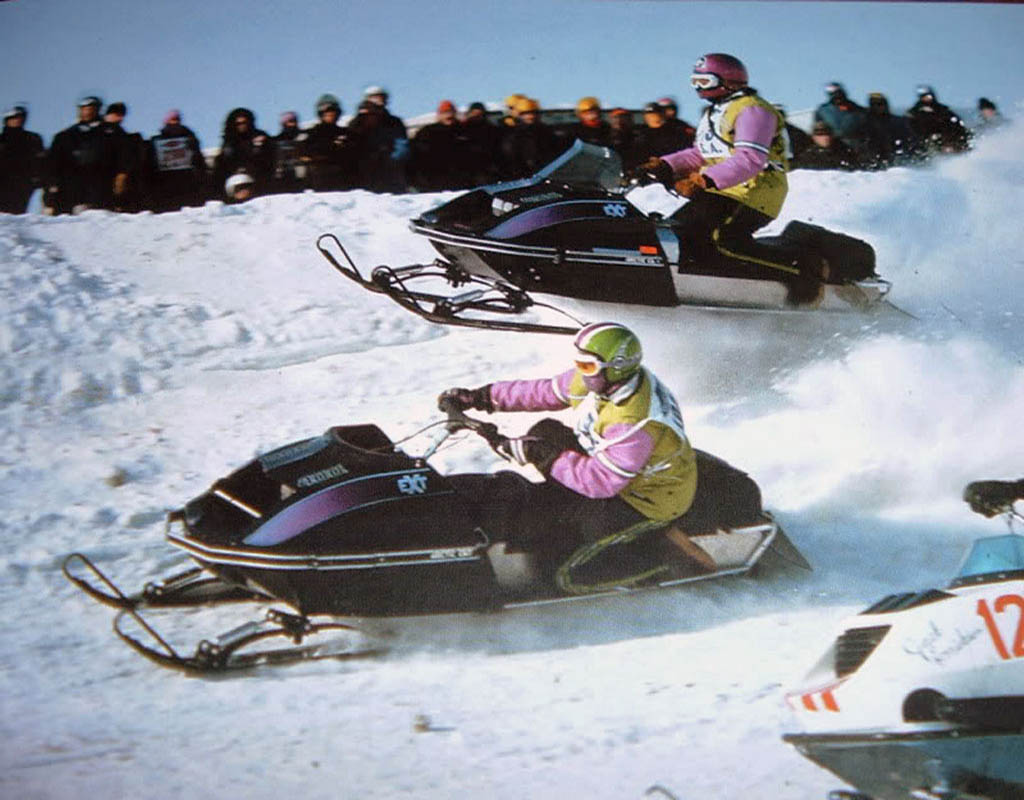 Vintage snow oval racing Arctic Cat EXTs.