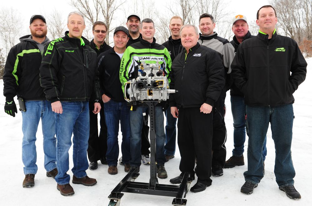 Arctic Cat personnel with the new C-TEC2 8000 engine in Jan. 2017. Photo by ArcticInsider.com