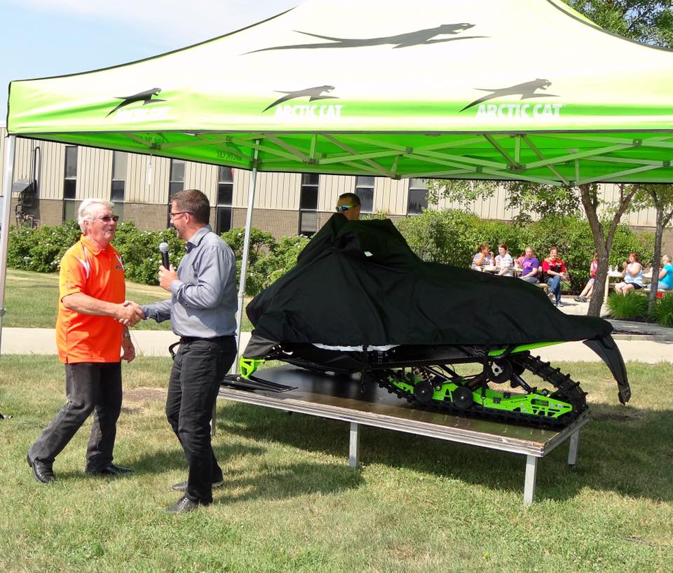 Arctic Cat's Roger Skime presented with his RS Edition snowmobile