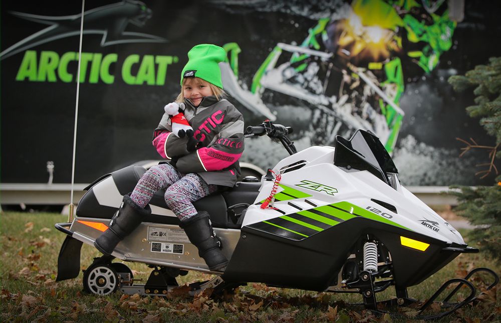 Sunshine Oelfke gets her Arctic Cat ZR 120 snowmobile.
