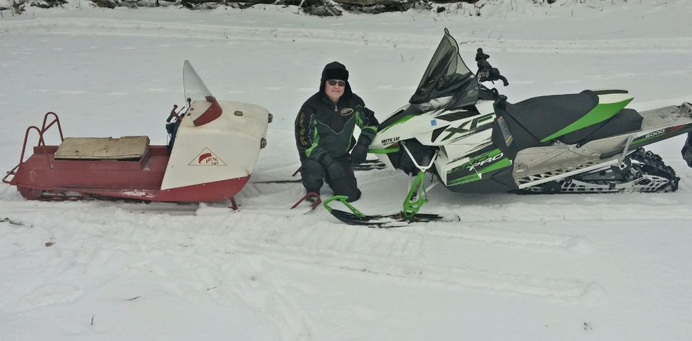Arctic Cat engine legend Donn Eide with his two classic sleds.