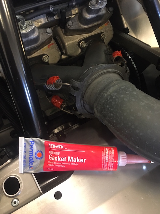 Gasket maker applied to exhaust springs decreases chances of them breaking