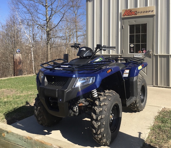 2019 Alterra 450 4x4 in stock form outside the Rox Speed FX shop