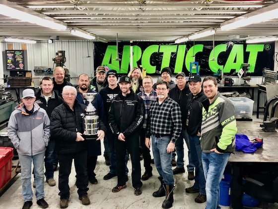 Mike Kloety orchestrated a group of past and present Arctic Cat employees and friends/family of Roger's to present him the Skime Traveling Cup 
