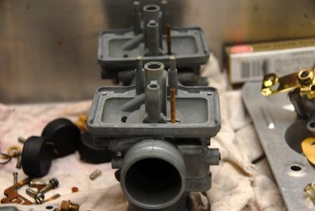 A couple Mikuni carbs in the middle of a rebuild
